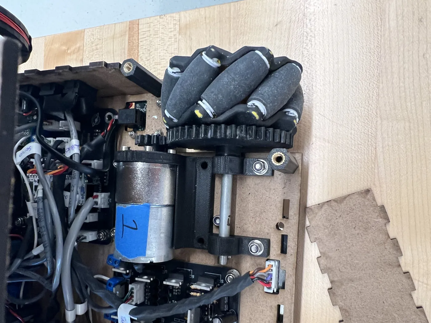 Close view of one of our robot's mecanum wheels, drive motor, and electronics